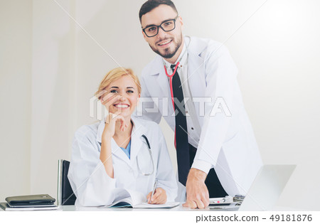 Happy doctor portrait with work partner. 49181876