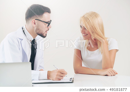 Male Doctor and Female Patient in Hospital Office 49181877