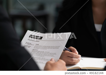 Human resources department manager reads CV resume Human resources department manager reads CV resume 49182144