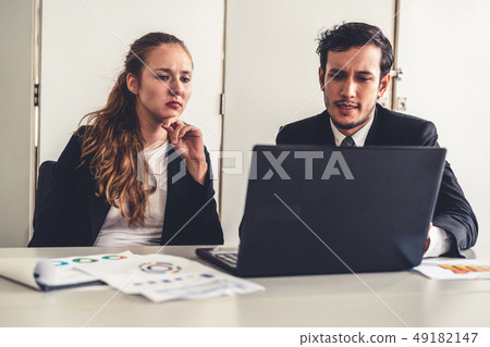 Unhappy serious businessman and businesswoman. Unhappy serious businessman and businesswoman. 49182147