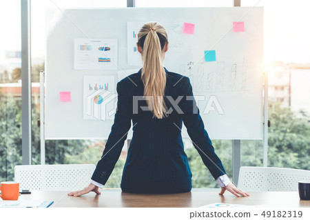 Businesswoman leader planning project in office. Businesswoman leader planning project in office. 49182319