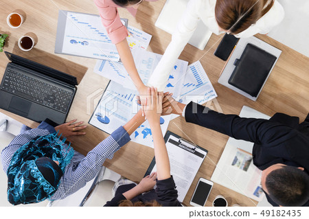 Teamwork business people join hands in meeting. Teamwork business people join hands in meeting. 49182435