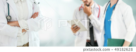 Doctor working in hospital with other doctors. Doctor working in hospital with other doctors. 49182628