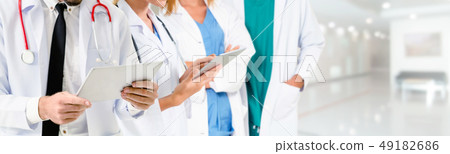 Doctor working in hospital with other doctors. Doctor working in hospital with other doctors. 49182686