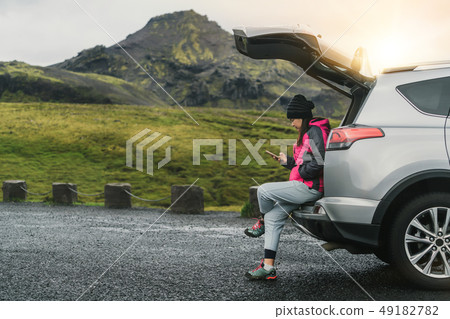 Woman tourist travel by SUV car in Iceland. Woman tourist travel by SUV car in Iceland. 49182782