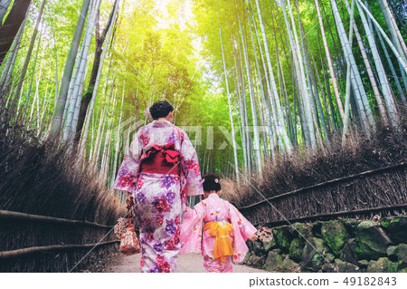 Traveler in Bamboo Forest Grove, Kyoto, Japan 49182843