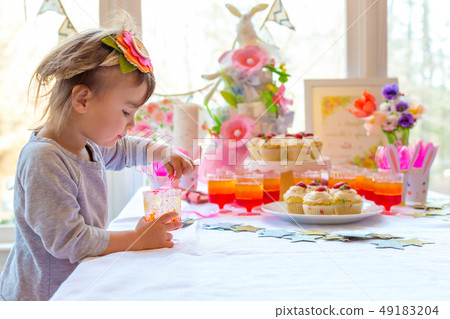 Little toddler girl eating dessert 49183204