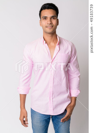 Portrait of young happy Indian businessman smiling Portrait of young happy Indian businessman smiling 49183739