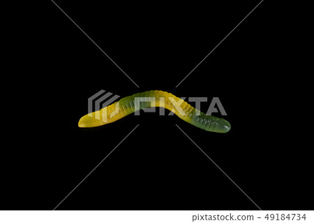 gummy jelly worm candy on a black background. gummy jelly worm candy on a black background. 49184734