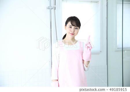 A woman cleaning a bath A woman cleaning a bath 49185915