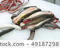We cook eel which is good for energetic. Peel off a dead eel 49187298