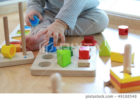 Baby playing a good shape game for brain development 49188548
