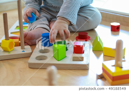 Baby playing a good shape game for brain development 49188549
