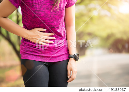Sport girl have stomach pain after jogging 49188987