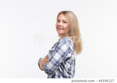 Teeth health, dentistry and bite correction - Happy smiling woman with braces on white background 49190127