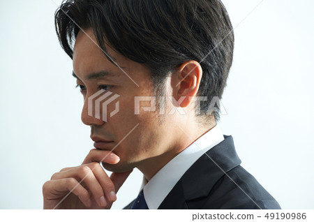 A business man who is thinking A business man who is thinking 49190986