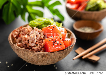 Poke bowl with raw salmon fish, chuka salad Poke bowl with raw salmon fish, chuka salad 49192764