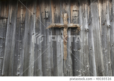 Wooden cross on a wooden wall  49193516