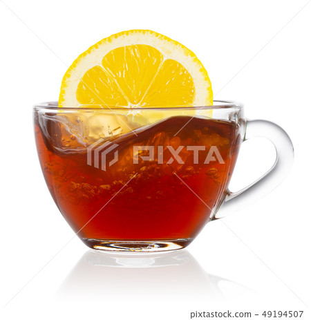 Lemon splash in transparent cup of tea Lemon splash in transparent cup of tea 49194507