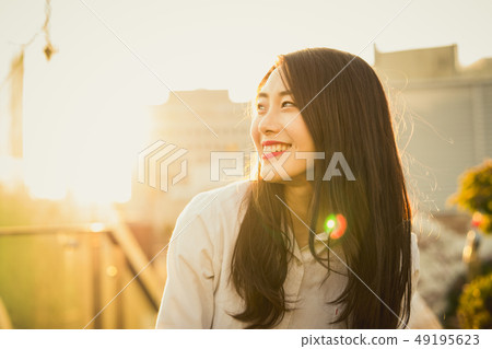 Woman female student college student college student glow evening Woman female student college student college student glow evening 49195623