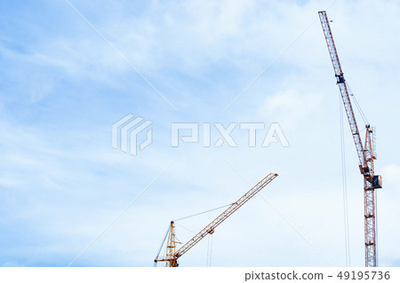 construction cranes construction of houses construction cranes construction of houses 49195736