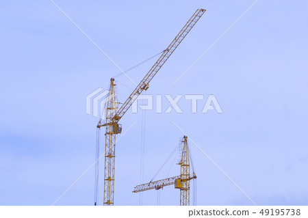 construction cranes construction of houses construction cranes construction of houses 49195738