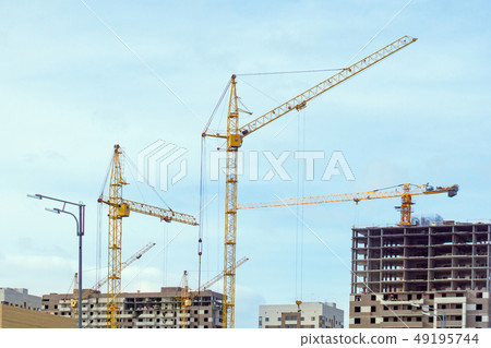 construction cranes build houses construction cranes build houses 49195744