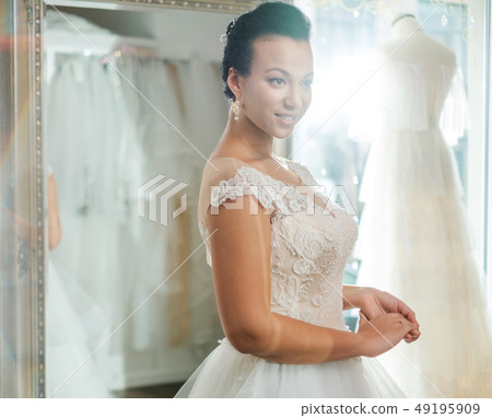 Athletic man practicing in a bouldering gym 49195909