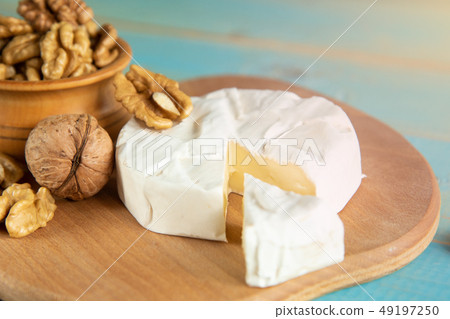 Cheese camembert or brie with walnut kernels Cheese camembert or brie with walnut kernels 49197250