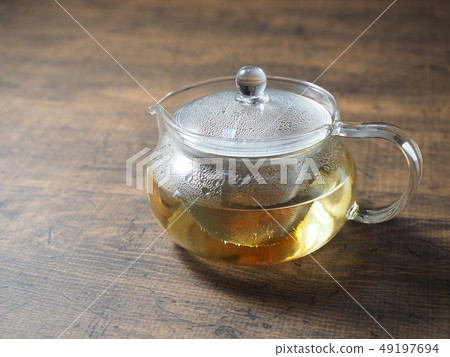 Glass teapot and tea 49197694
