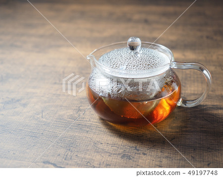 Glass teapot and tea 49197748