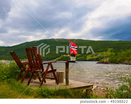 Rest stop area on norwegian fjord shore 49198822