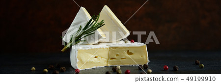 Cheese camembert or brie with fresh rosemary Cheese camembert or brie with fresh rosemary 49199910