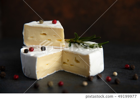 Cheese camembert or brie with fresh rosemary 49199977