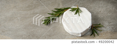 Cheese camembert or brie with fresh rosemary Cheese camembert or brie with fresh rosemary 49200042