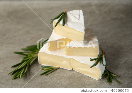 Cheese camembert or brie with fresh rosemary 49200073