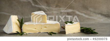 Cheese camembert or brie with fresh rosemary Cheese camembert or brie with fresh rosemary 49200078