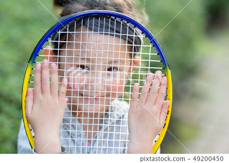 Girl with tennis racket 49200450