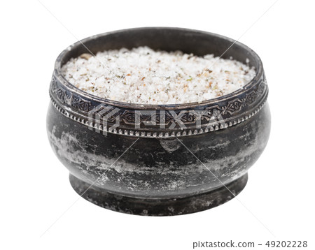 side view of silver salt cellar with seasoned salt 49202228