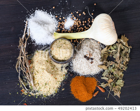 view of Seasoned Salts with ingredients on table 49202413