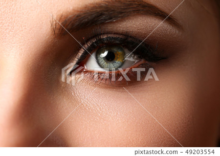 Female left emerald green coloured eye extreme closeup Female left emerald green coloured eye extreme closeup 49203554