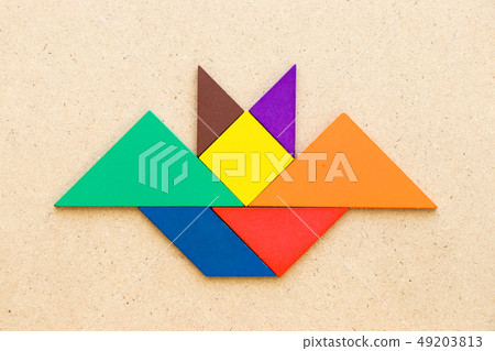 Color tangram in flying bat shape Color tangram in flying bat shape 49203813
