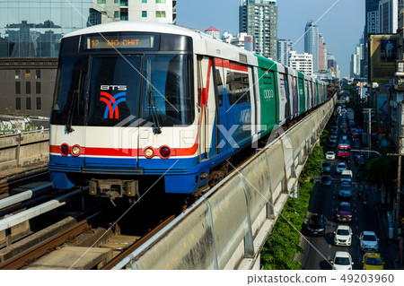 BTS Skytrain running in to the station in the 49203960