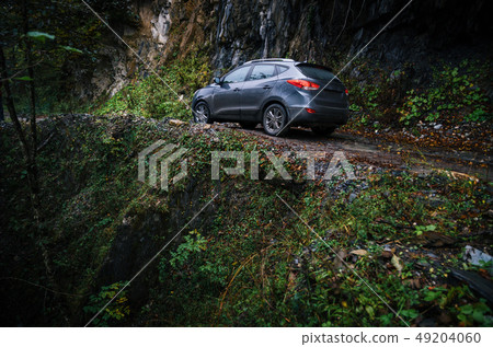 Off-road travel on car on mountain road, Caucasus Off-road travel on car on mountain road, Caucasus 49204060