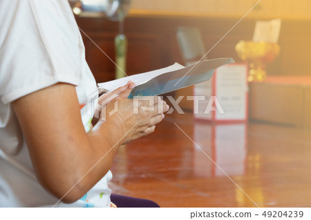 Girl praying at temple. Girl praying at temple. 49204239