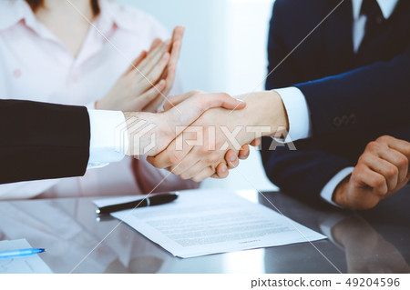 Business people shaking hands finishing up a meeting. Handshake at successful negotiation 49204596