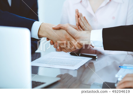 Business people shaking hands finishing up a meeting. Handshake at successful negotiation 49204619