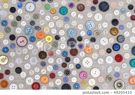 background - multicolored buttons on the fabric background - multicolored buttons on the fabric 49205410