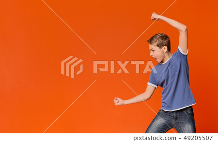 Angry irritated furious boy ready to fight 49205507