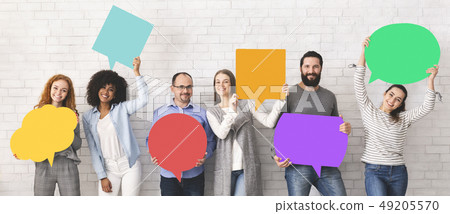Group of diverse people holding colorful speech bubbles Group of diverse people holding colorful speech bubbles 49205570